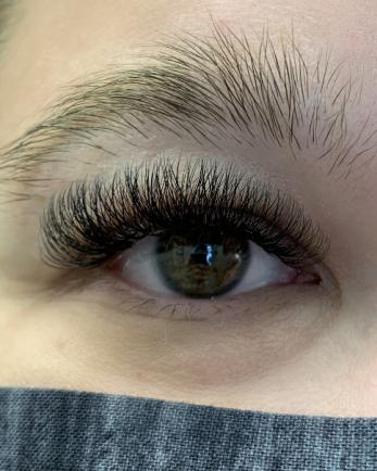 Woman's eye with eyelash extensions from revolve lash