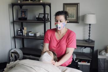 Jessica McGrory, owner of Portland Massage Center, LLC, gives a patient massage therapy.