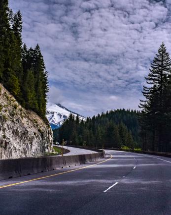 A paved road leads up to Mt. Hood